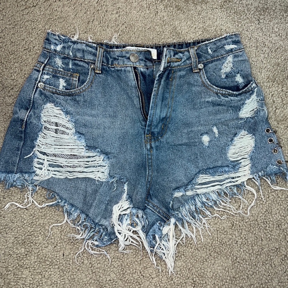 Distressed Blue Jean shorts from Elle Rae Boutique. Size small. Great condition!